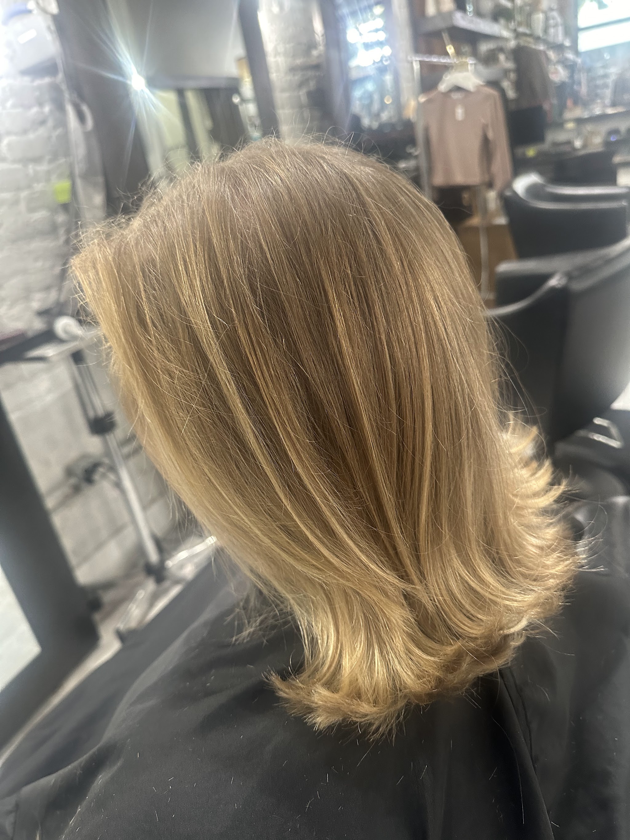 Blonde layered bob finished at the salon